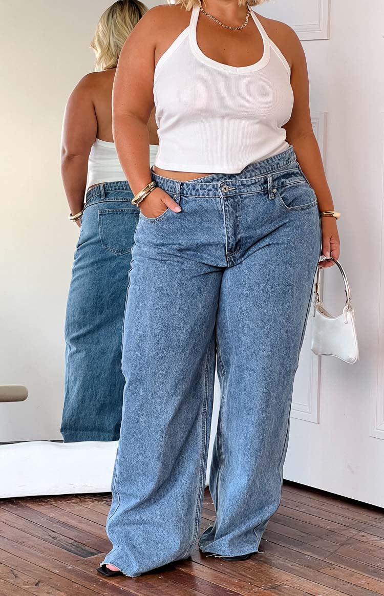 Beginning Boutique Kansis Blue Uneven Waist Jeans blue denim straight leg jeans with an uneven button-fly waist
