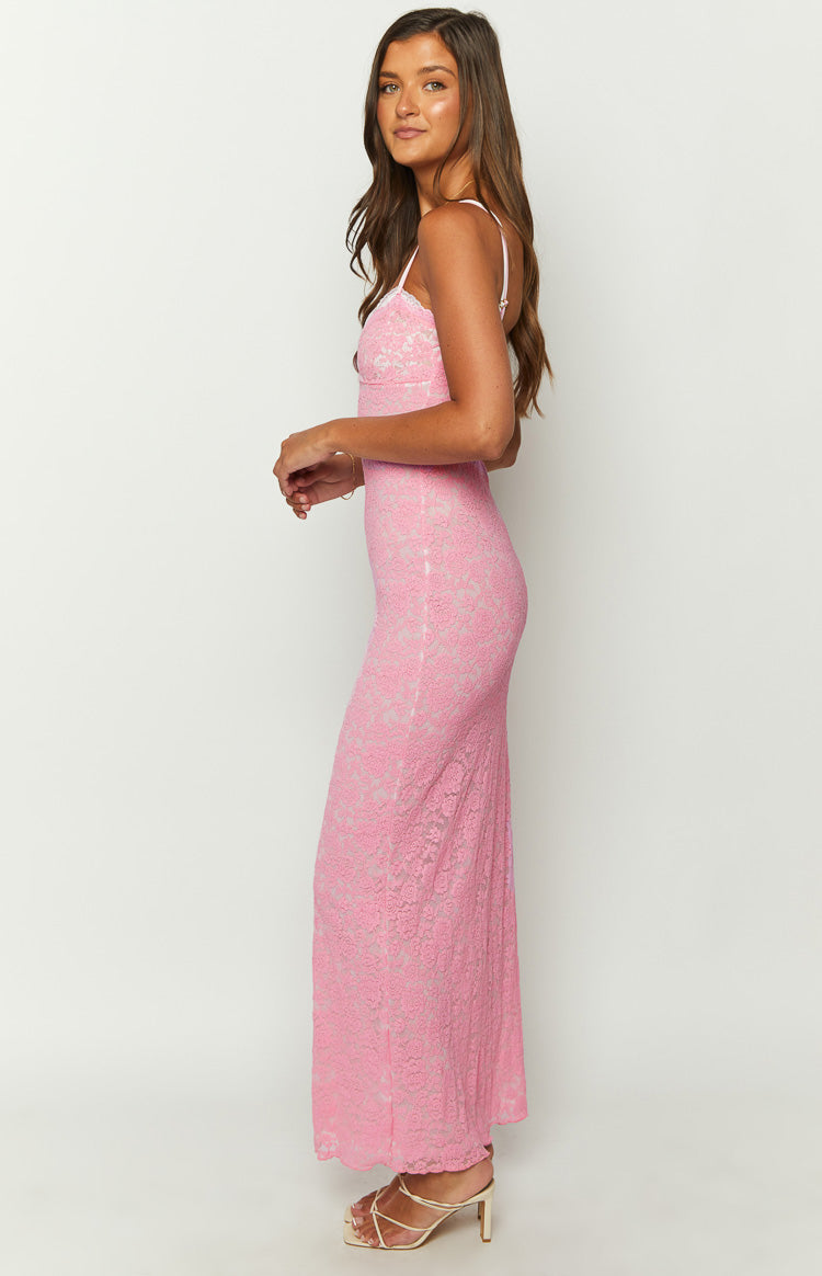 Side view of a form-fitting pink lace maxi dress with thin spaghetti straps, showing the full-length silhouette