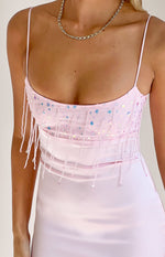 Close-up of the light pink mini dress bodice with iridescent sequins, beaded fringe, and thin spaghetti straps
