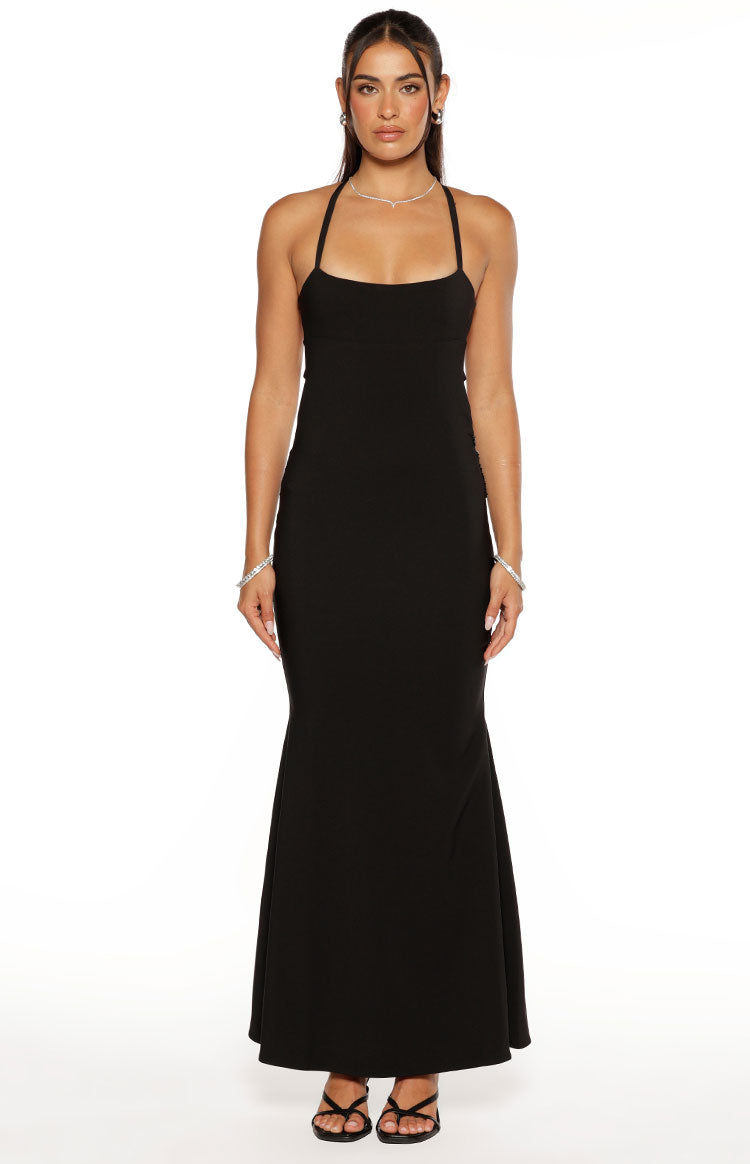 Front view of a black maxi dress with a square neckline, thin halter straps, and a fitted silhouette that flares at the hem
