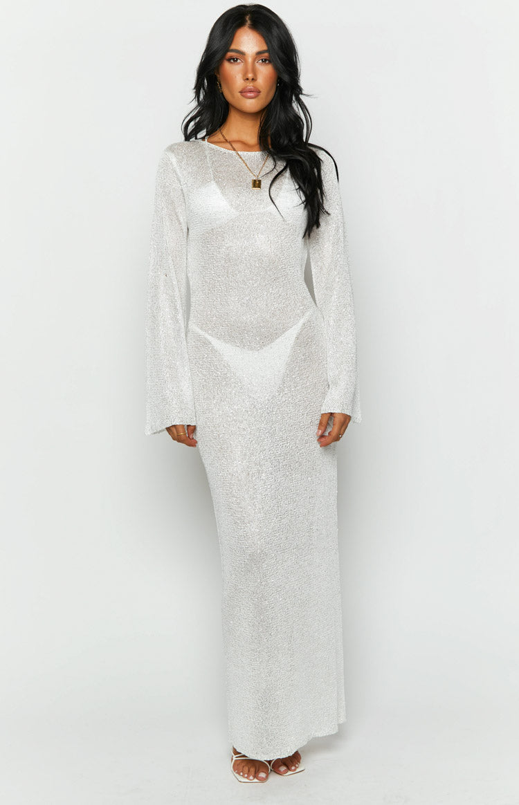 Front view of a white sheer sequin knit maxi dress with a round neck and long flared sleeves