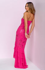 Side view of the pink strapless maxi dress showing the tiered ruffle skirt and all-over beading