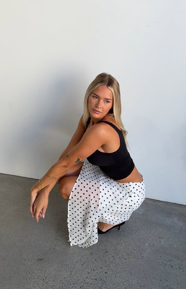 Beginning Boutique Khalea White Polka Dot Hanky Hem Midi Skirt white sheer polka dot midi skirt with a flowy hanky hem