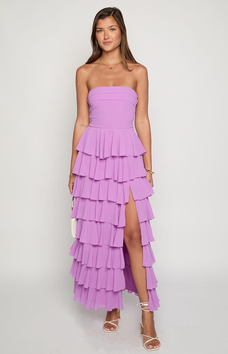 Magenta strapless maxi dress with a tiered ruffle skirt and a high side slit