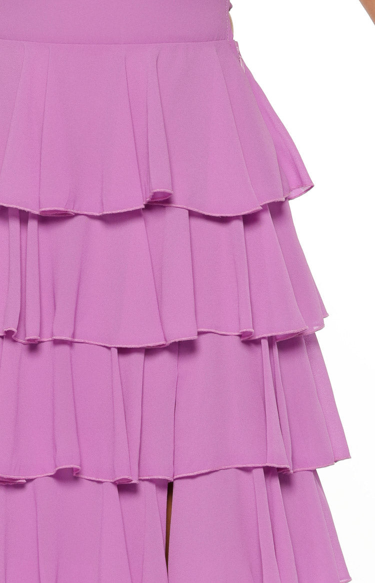 Close-up of the magenta maxi dress skirt showing five distinct layers of gathered ruffles