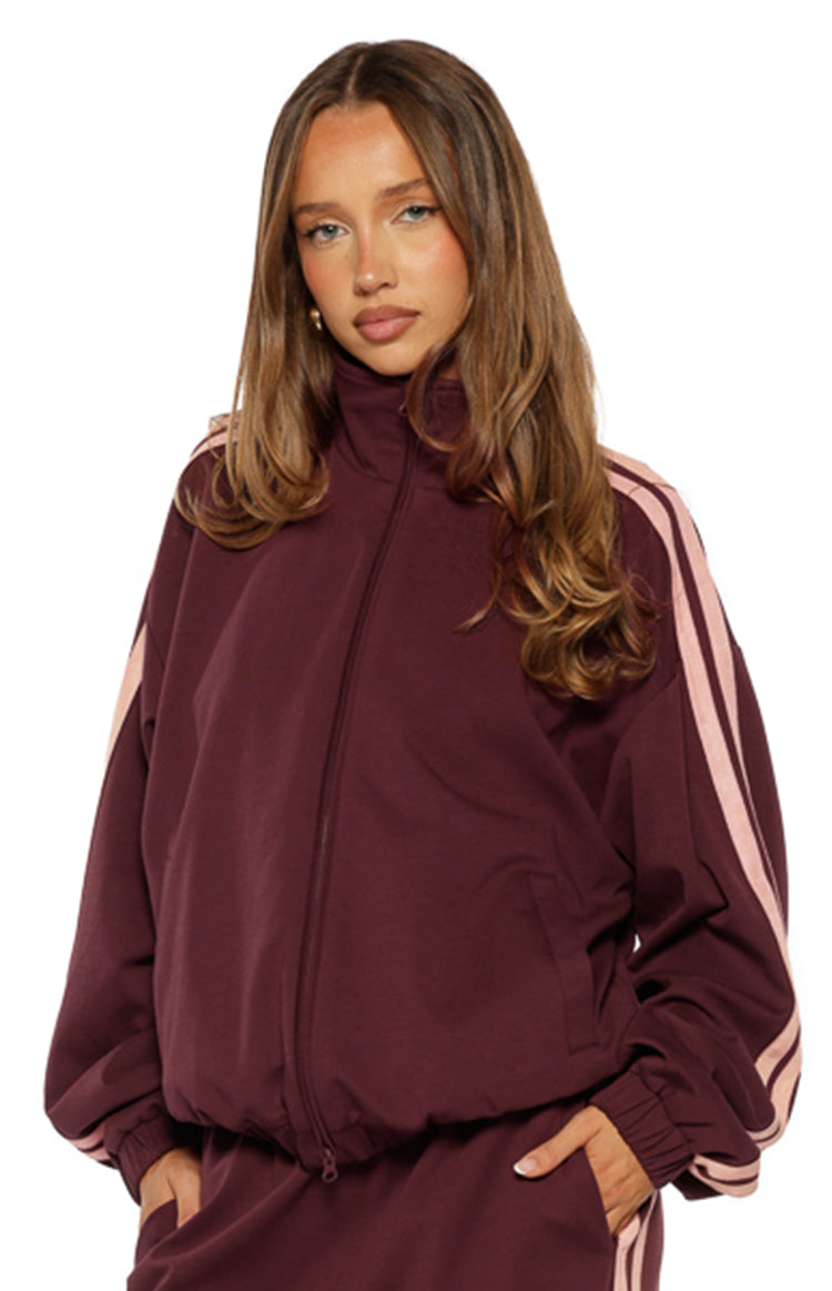 Beginning Boutique Kosie Burgundy and Pink Stripe Track Jacket — burgundy track jacket with high collar, full zip, elasticated hem, and pink double stripes on sleeves