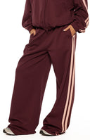 Beginning Boutique Kosie Burgundy and Pink Stripe Track Pants burgundy wide-leg track pants with double pink side stripes