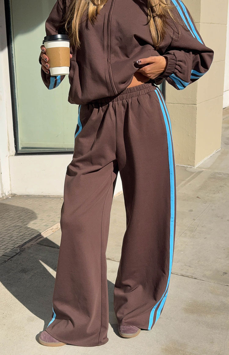 Beginning Boutique Kosie Chocolate And Blue Stripe Track Pants chocolate brown wide-leg track pants with blue side stripes