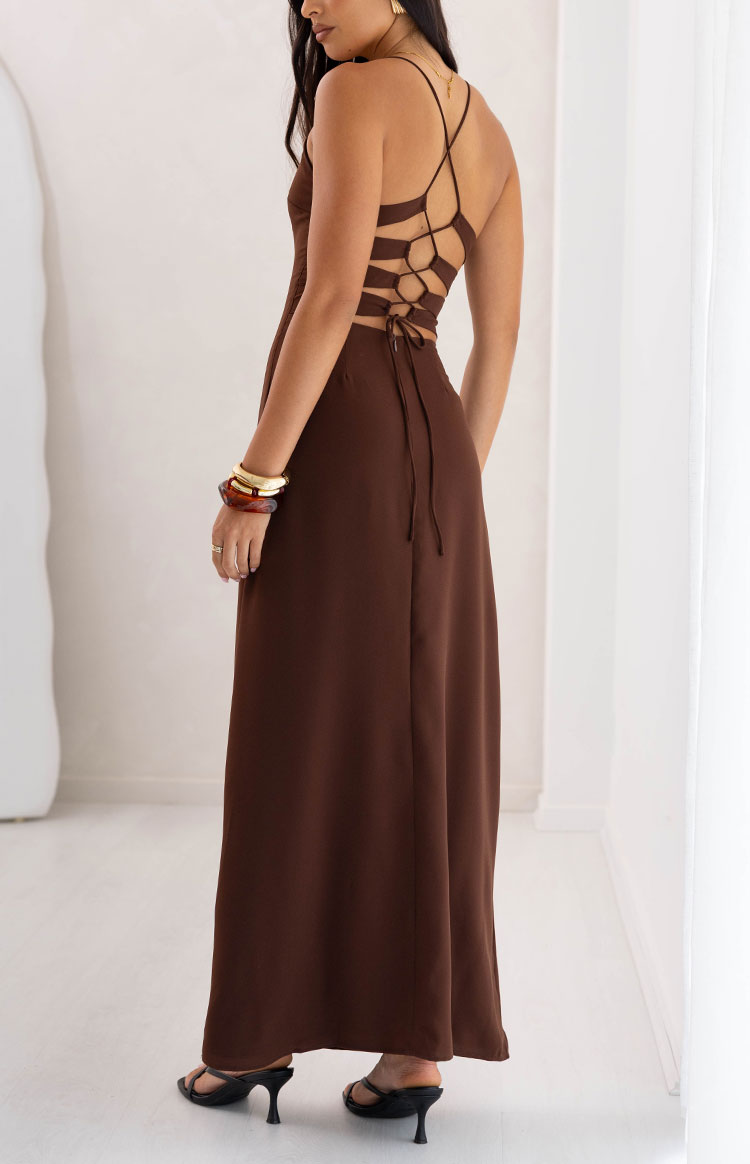 Rear view of a brown maxi dress showing the intricate lace-up back detail with thin criss-cross straps and ties