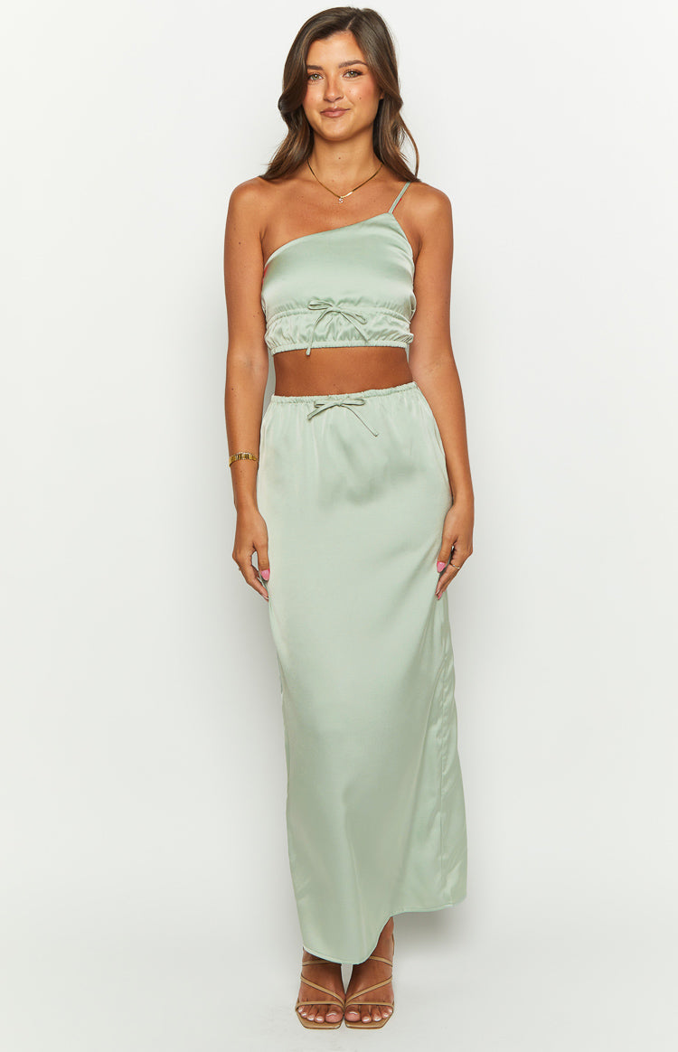 Sage green satin one-shoulder crop top with a thin spaghetti strap and ruched elasticated hem with front tie