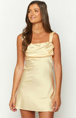 Yellow satin mini dress with a square neckline and draped detail on the bodice