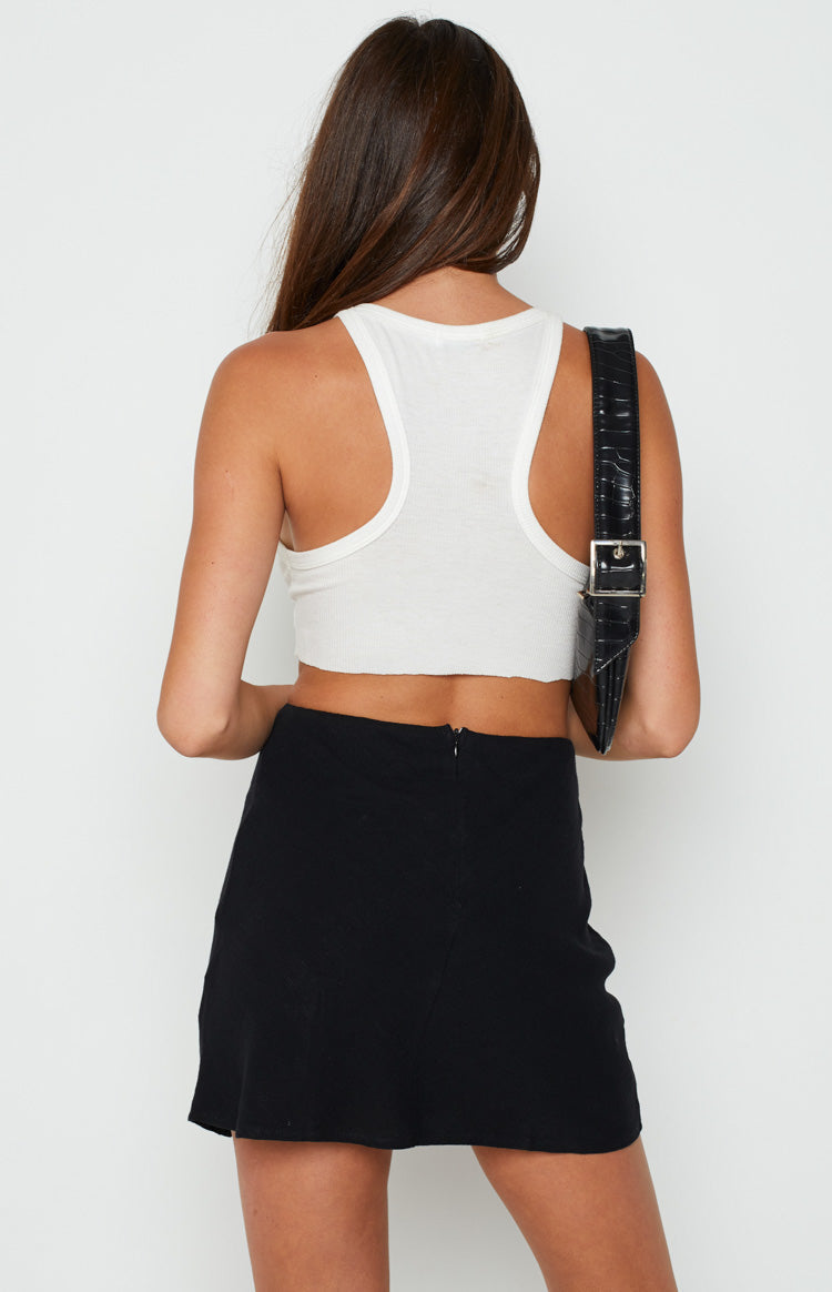 Black mini skirt with a visible back zipper closure and a subtle textured fabric