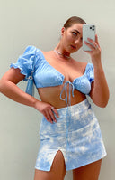 Blue and white cloud tie-dye denim mini skirt with a high waist and a left side slit