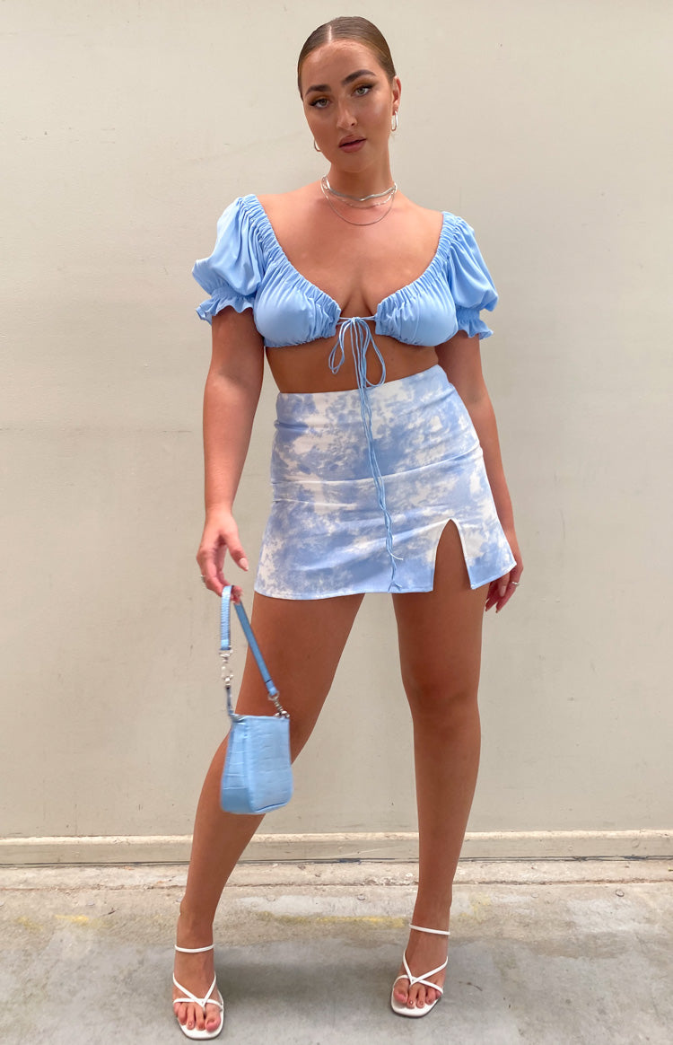 Sky blue and white cloud tie-dye denim mini skirt with a high left thigh slit