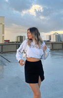 Black mini skirt with a high side slit