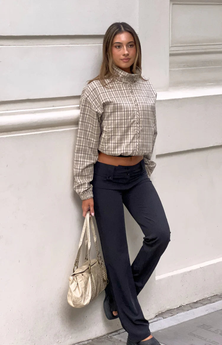 Front view of a beige plaid funnel neck jacket with a relaxed fit, cropped length, and elasticated hem