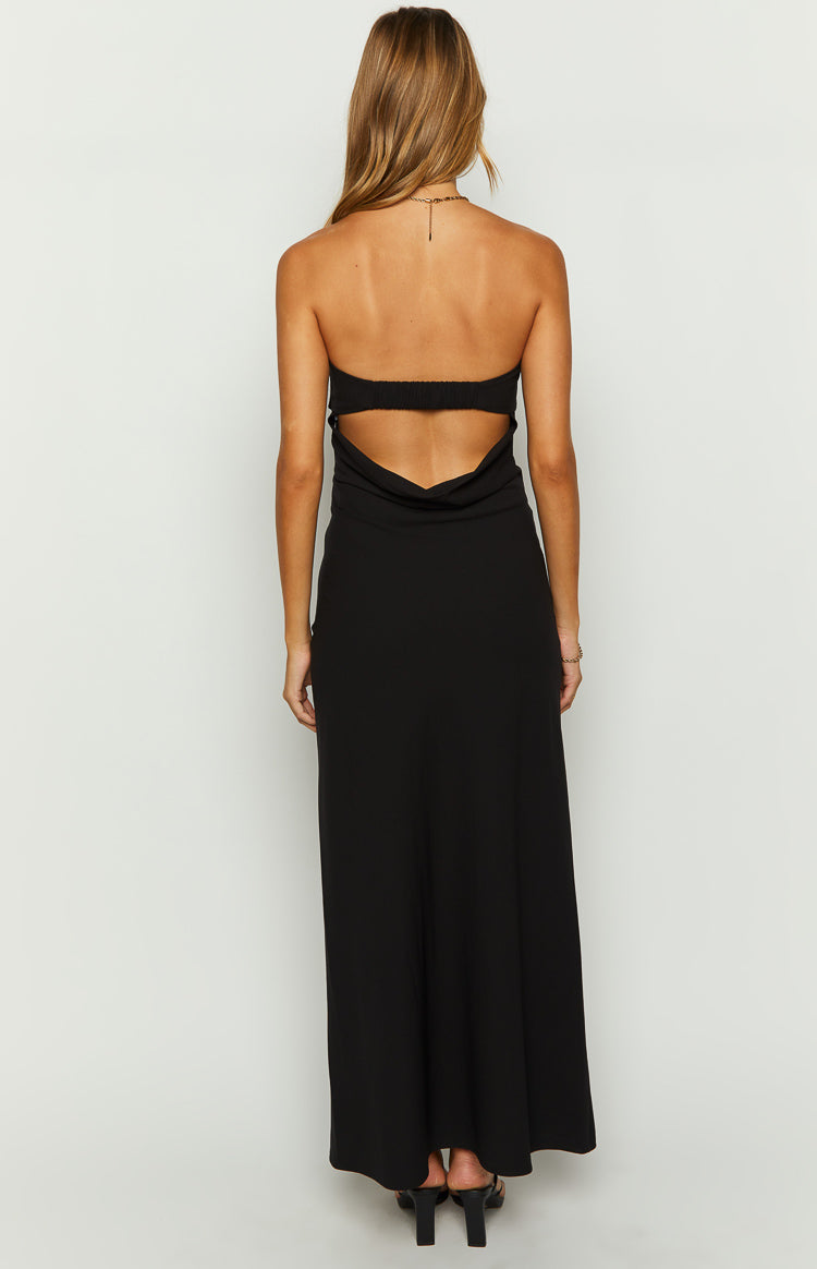 Close-up of the black strapless maxi dress showing the wide folded band detail at the neckline