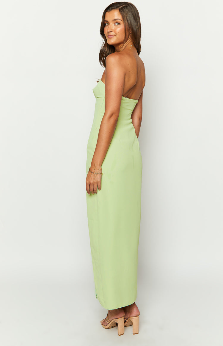 Side view of a green strapless maxi dress with a fitted bodice and flowing skirt