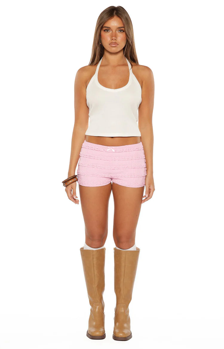 Rear view of pink textured micro shorts with horizontal lace trim details