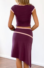 Back view of a cropped grape jersey top featuring pink binding along the neckline and short sleeves
