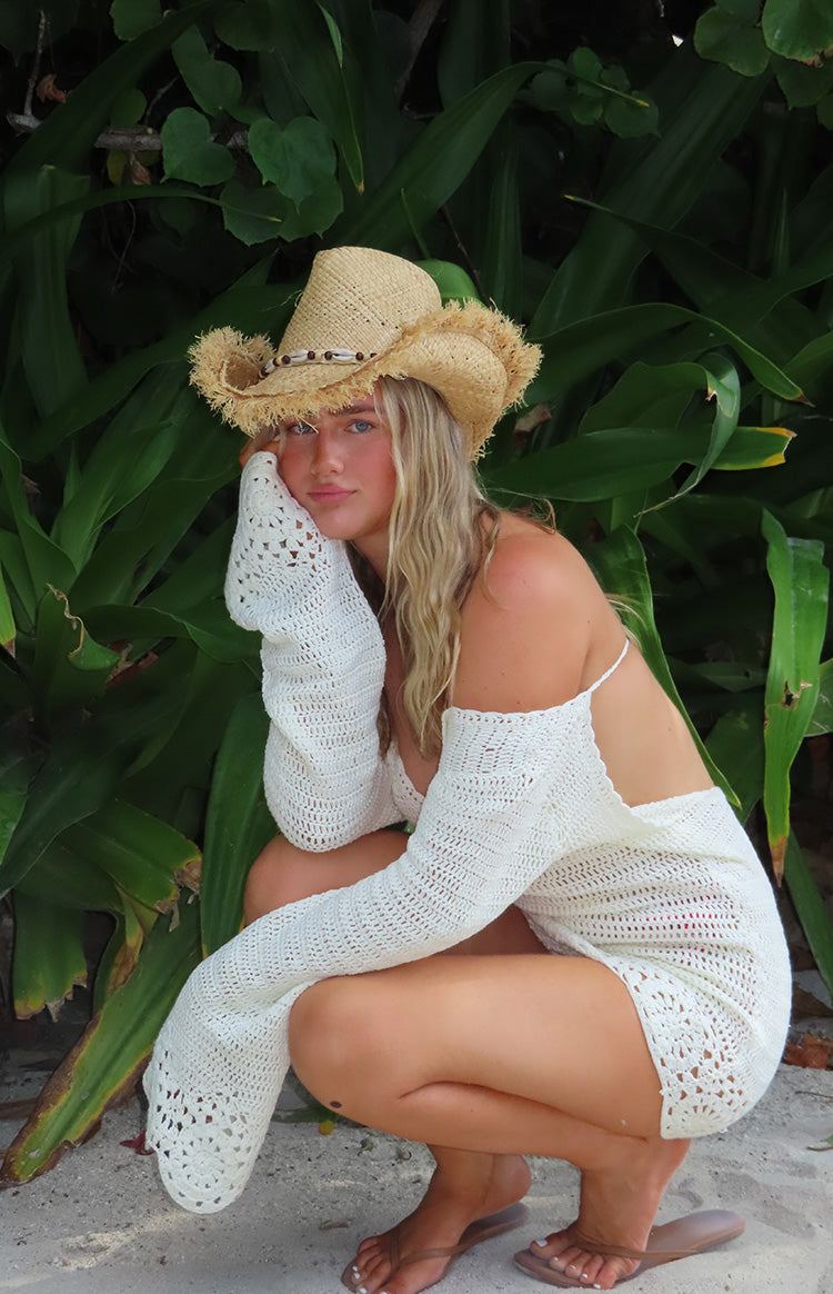 Beginning Boutique Li White Crochet Long Sleeve Mini Dress white crochet off-shoulder mini dress with long bell sleeves and open knit details