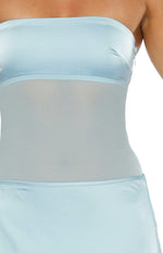 Close-up of the light blue strapless satin bodice with a sheer mesh midriff panel and a side zipper