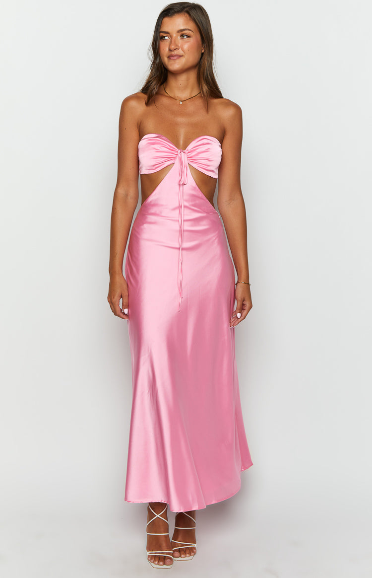 Pink satin strapless maxi dress with a bow detail on the bust and side cutouts at the waist