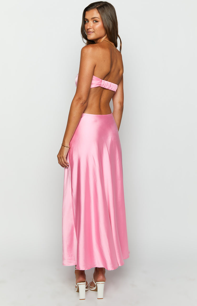 Close-up of the pink satin strapless maxi dress showing the ruched bow bust with tie detail and side waist cutouts