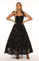 Black maxi dress with tie-shoulder straps, sweetheart neckline, and a full skirt with a subtle floral texture