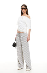 Front view of ash grey and white striped wide-leg pants with a relaxed fit and drawstring waist