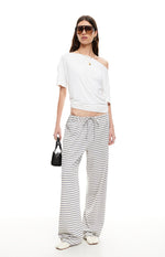 Full length view of ash grey and white striped wide-leg pants with a drawstring waist