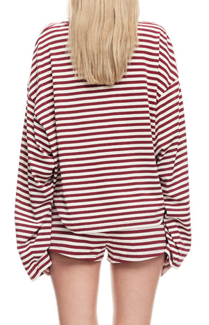 back angle of a maroon red and white two piece set of lounge shorts and a long sleeved shirt