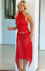 Red crochet halter top with a high neckline, intricate floral pattern, and a scalloped cropped hem