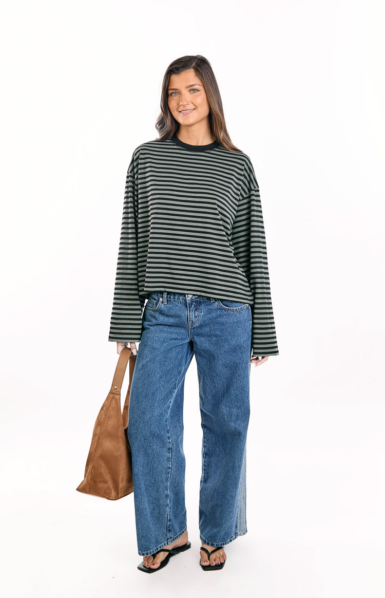 Forest green and black striped long sleeve top with a relaxed, slightly cropped fit