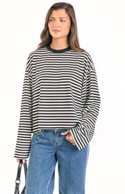 Relaxed fit black and white striped long sleeve top with a black crew neck and wide sleeves