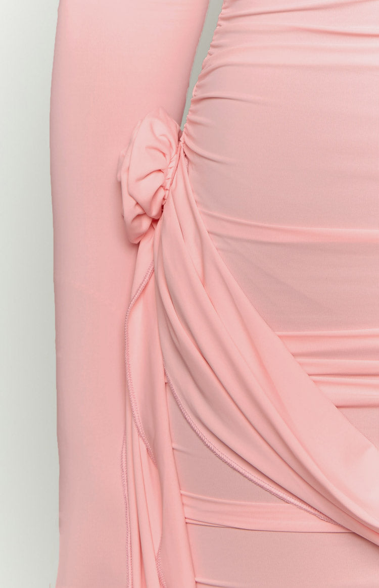 Close-up of the ruched side detail with a fabric knot and draped panel on a blush pink mini dress