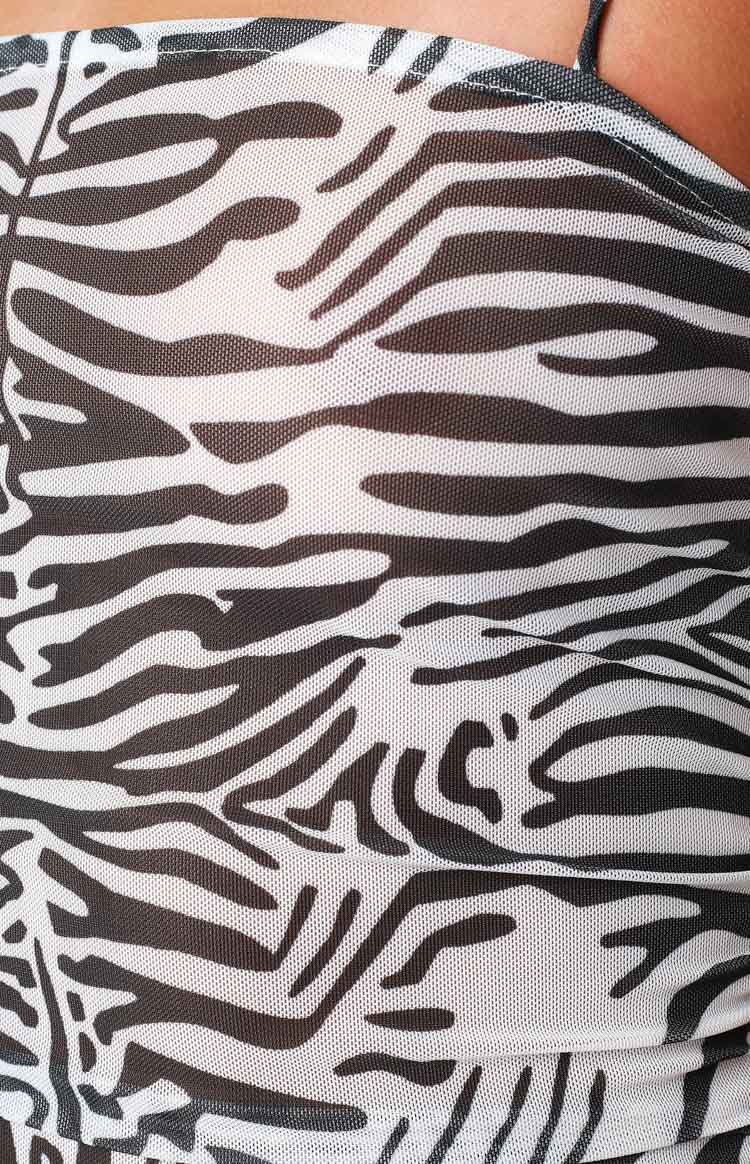 Front view of the zebra print mesh mini dress with a square neckline and ruched bodycon fit
