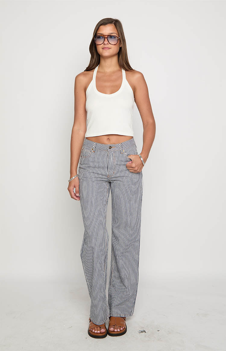Navy and white vertical stripe wide-leg jeans with a relaxed fit and mid-rise waist