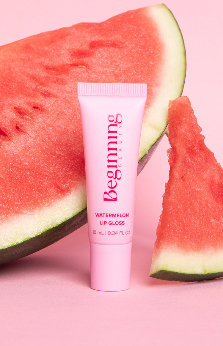 Pink squeeze tube of lip gloss with ribbed cap and 10 mL volume printed on the front