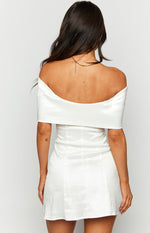 Rear view of a white satin off-shoulder mini dress with a wide folded neckline and fitted bodice