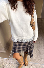 Beginning Boutique Lolly Cream Lace Trim Knit cream soft knit sweater with a round neck, relaxed fit, and white lace trim at the hem