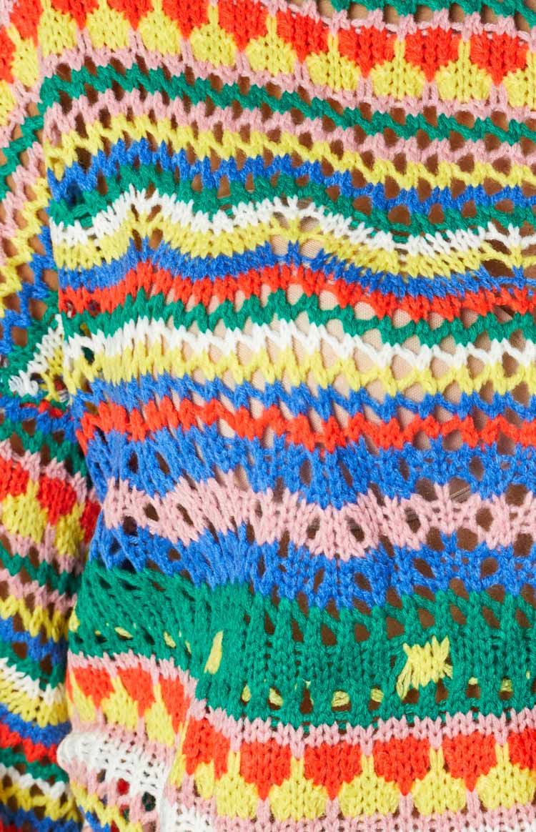 Cropped multi-colour open-knit sweater with a high neck and wide bell sleeves, featuring a zig-zag pattern