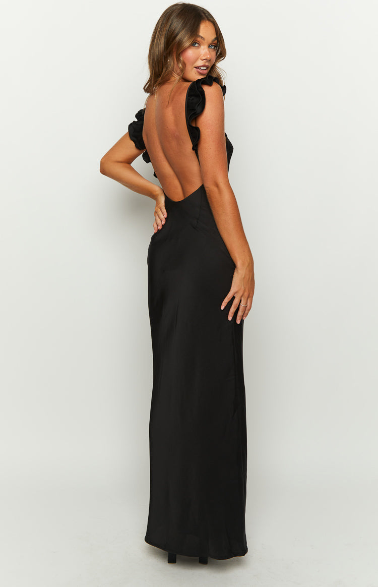 Full length front view of a black formal dress with an asymmetrical neckline and a ruffled shoulder strap