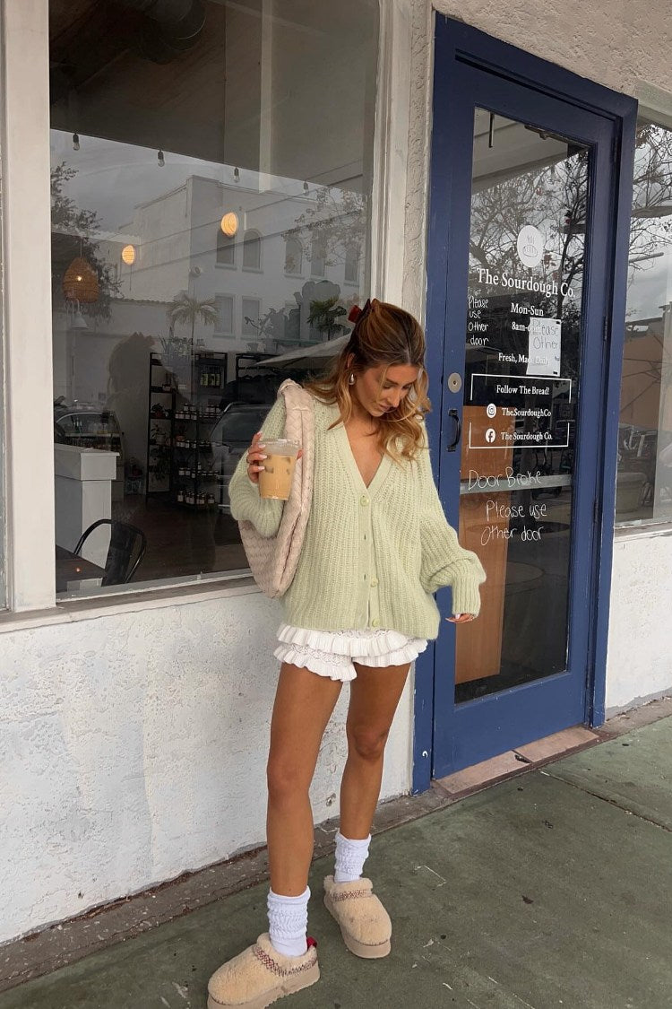 White knit ruffle shorts with tiered lace trim and a short length