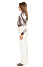 Side view of a chocolate stripe cropped cardigan with long sleeves and brown cuffs