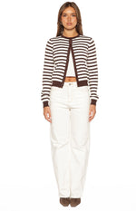 Front view of a chocolate and white stripe round neck cardigan worn open, showing the cropped fit