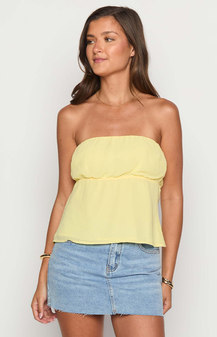 Beginning Boutique Lou Lou Yellow Strapless Top light yellow sheer strapless top with gathered bust and elasticated peplum waist