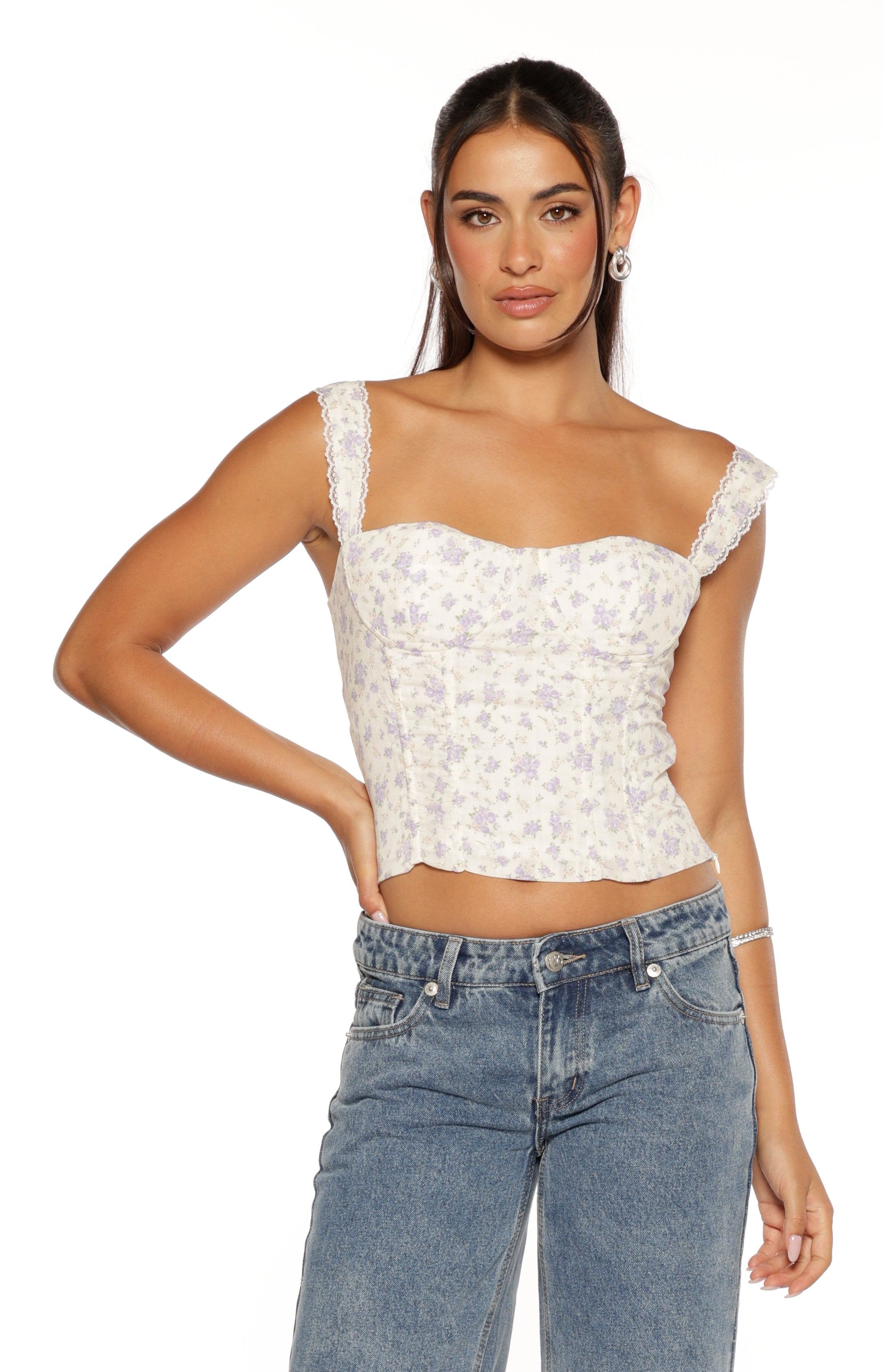 White corset top with purple floral print, sweetheart neckline, delicate lace trim on the shoulder straps