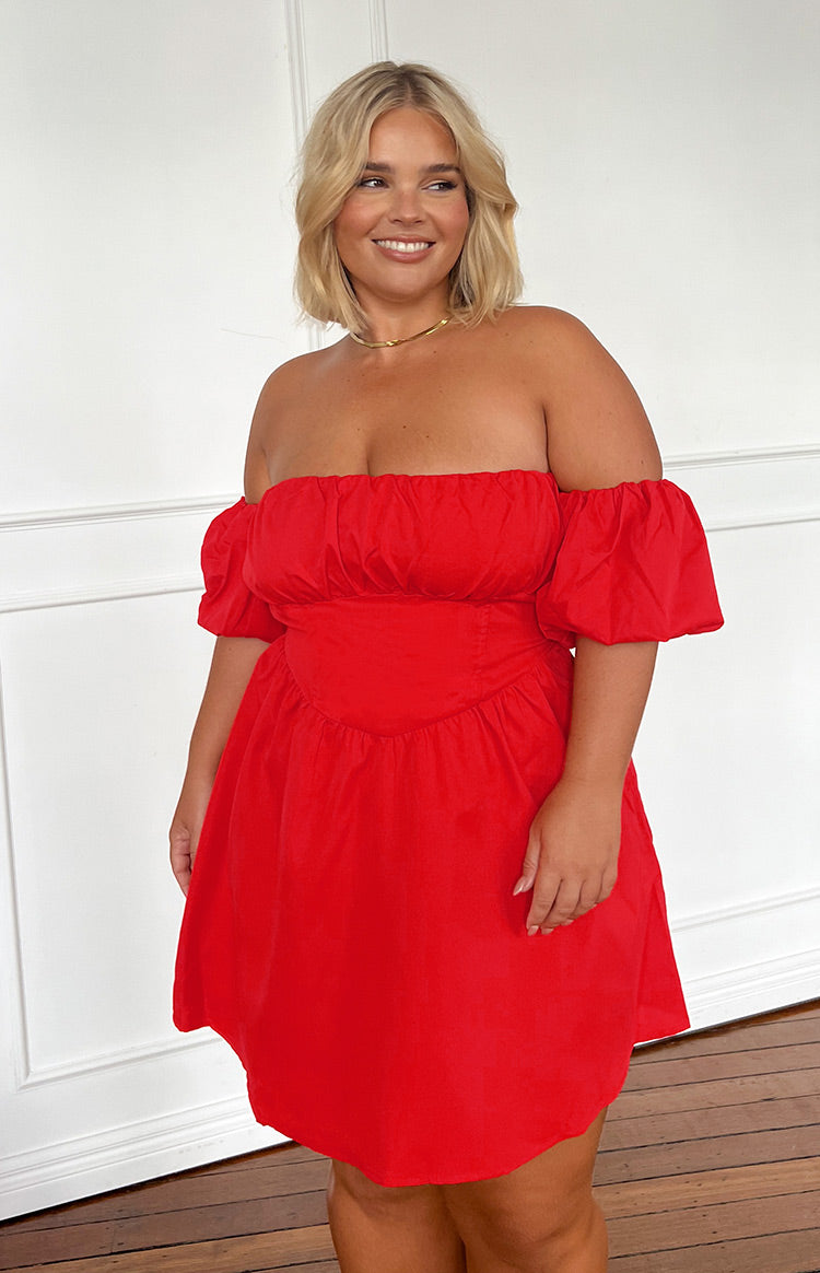 Front view of a red off-the-shoulder mini dress with a ruched bodice and V-shaped waistline