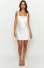 White satin mini dress with a square neckline and delicate floral applique straps